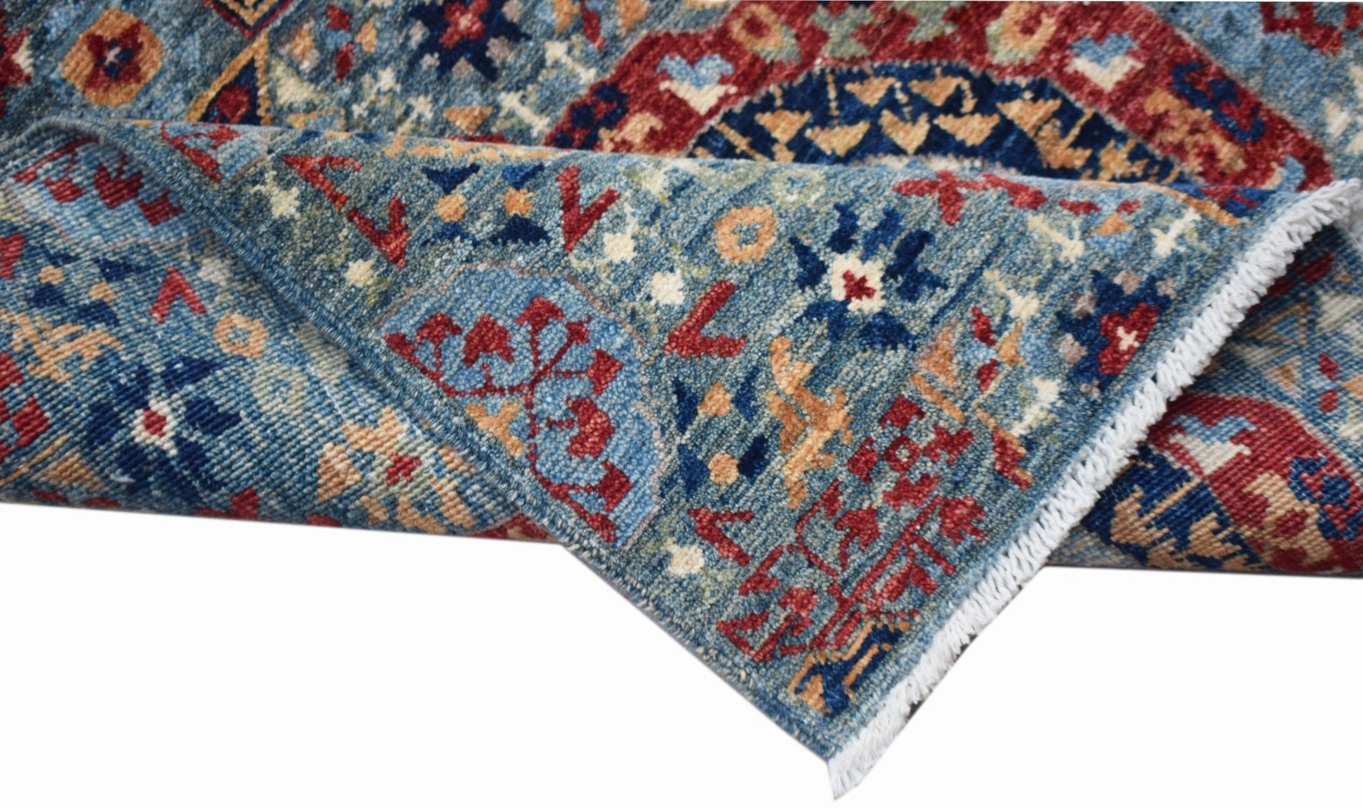 A handwoven Afghan Chobi runner featuring a traditional blue Mamluk pattern with red accents.