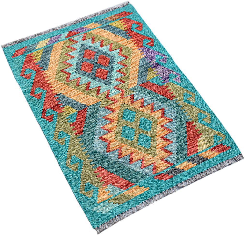 A rectangular handmade Afghan Maimana kilim featuring a vibrant geometric pattern in wool.