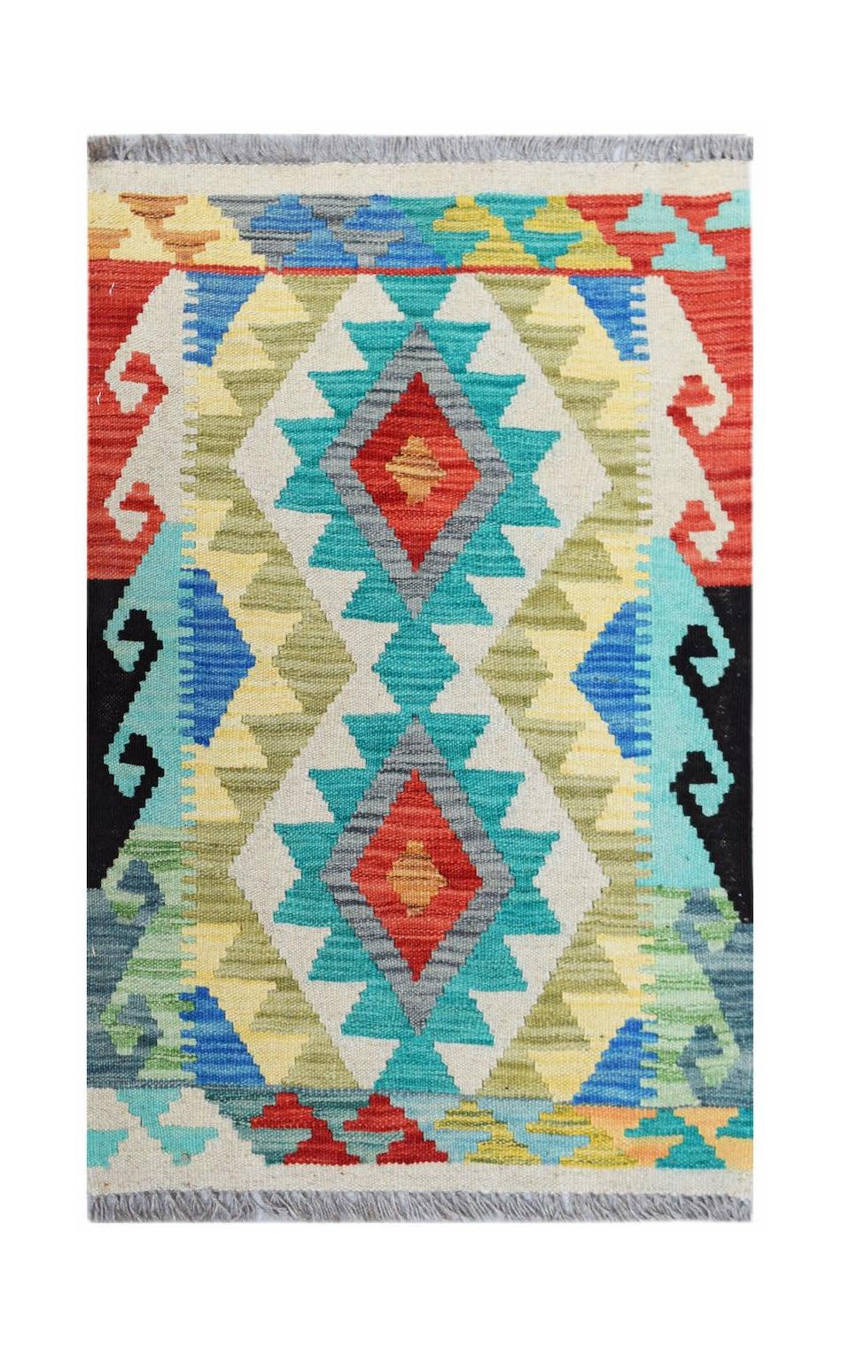 A rectangular handmade Afghan Maimana kilim rug featuring a vibrant geometric diamond pattern.