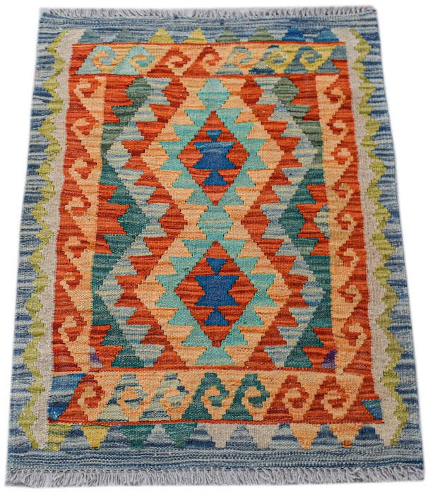 A rectangular handmade Afghan Maimana kilim featuring a geometric diamond pattern in vibrant colors.