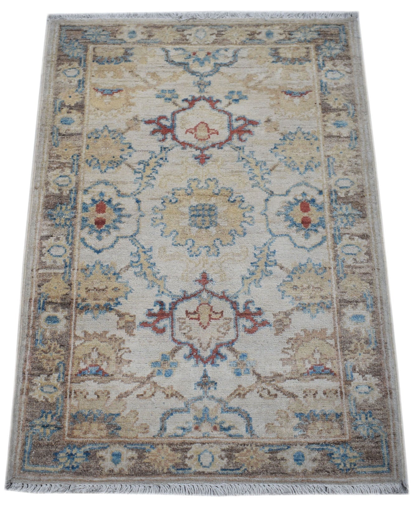 A handmade wool Afghan Chobi rug featuring a traditional floral pattern in beige, blue, and red.