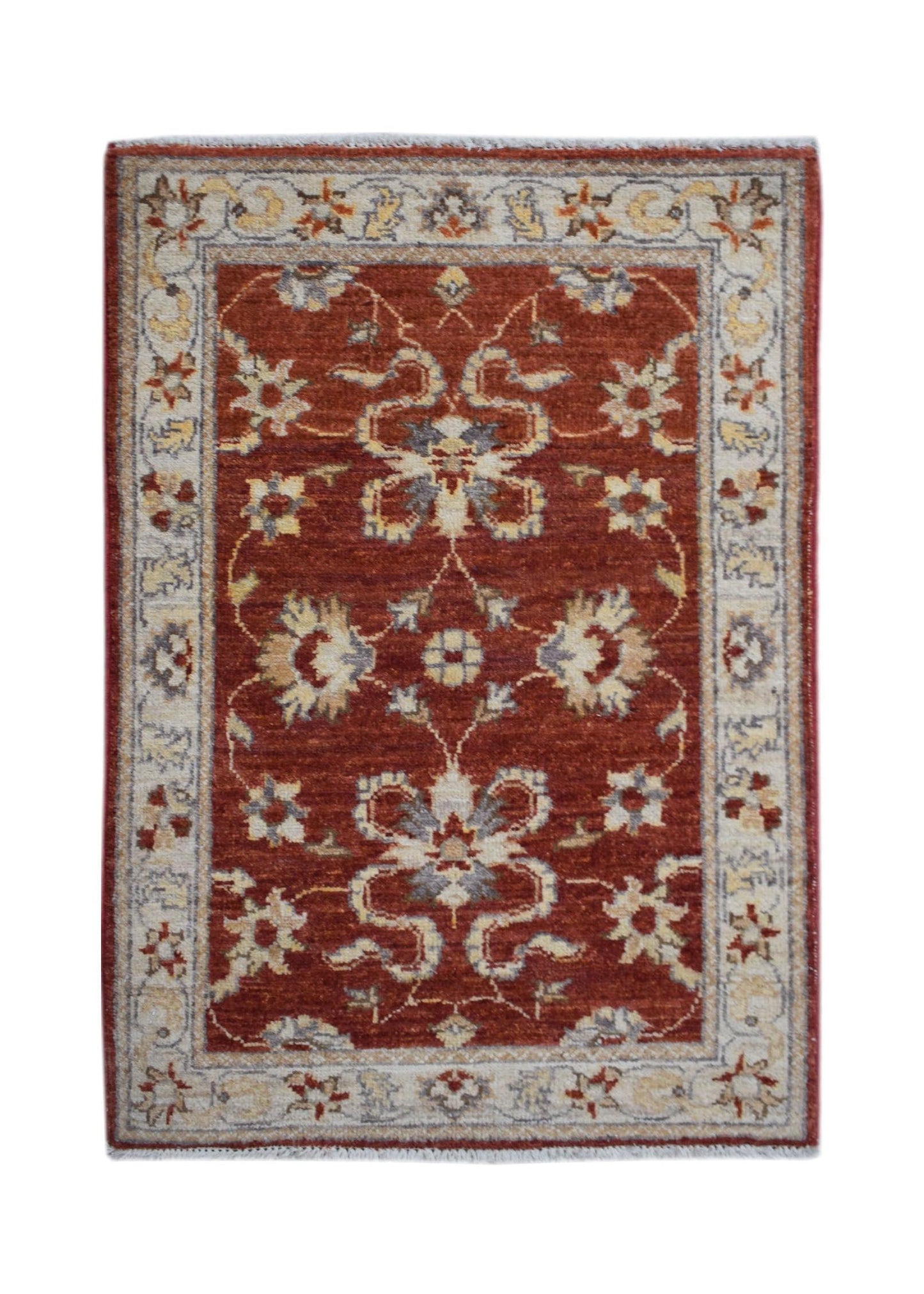 A rectangular handmade Afghan Chobi rug featuring a floral pattern in rust red and cream tones.