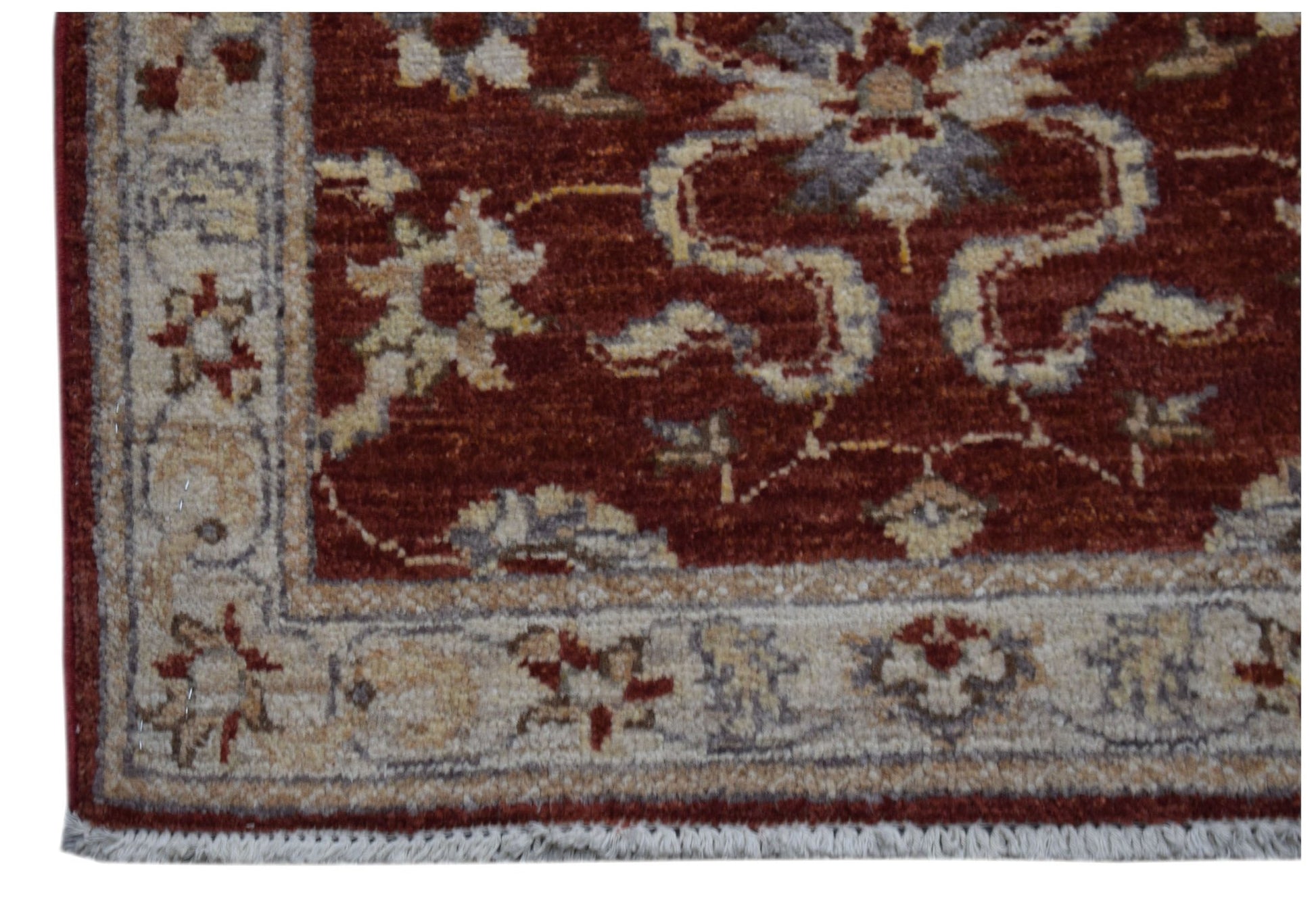 A handmade Afghan Chobi rug featuring a traditional floral pattern in red, beige, and grey tones.