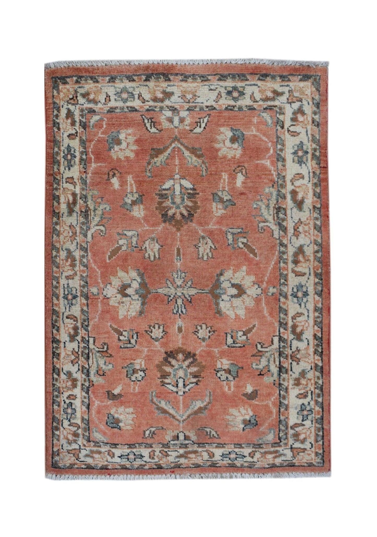 A handmade Afghan Chobi rug featuring a floral pattern in shades of terracotta, cream, and blue.