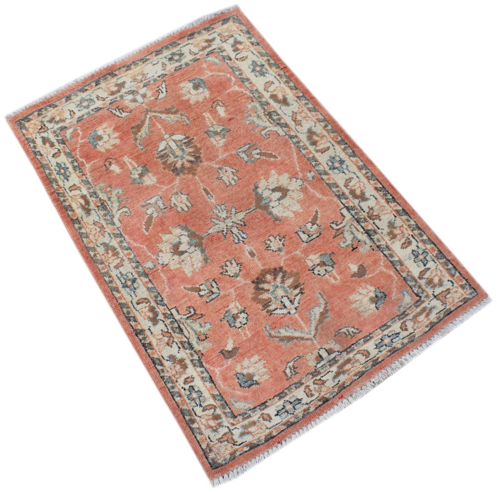 Handmade Afghan Chobi rug featuring a floral pattern in shades of terracotta, cream, and blue.