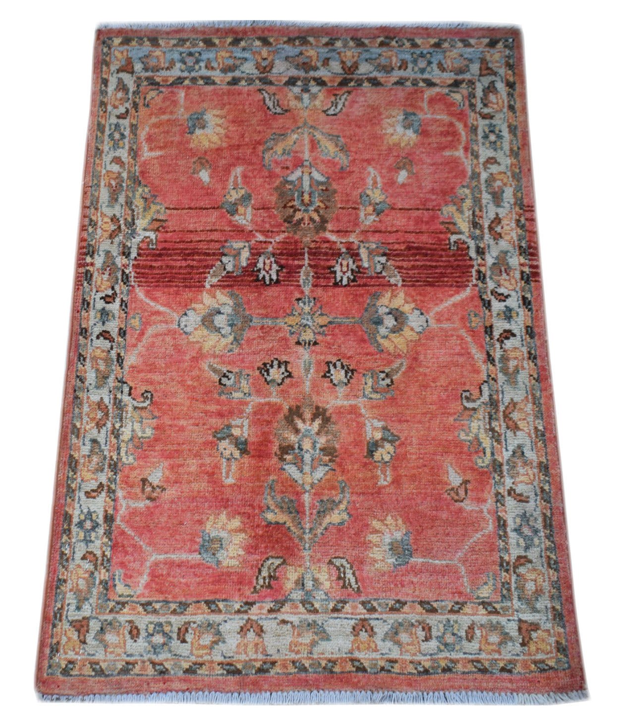 A handmade Afghan Chobi rug featuring a floral pattern in shades of red, blue, and beige.