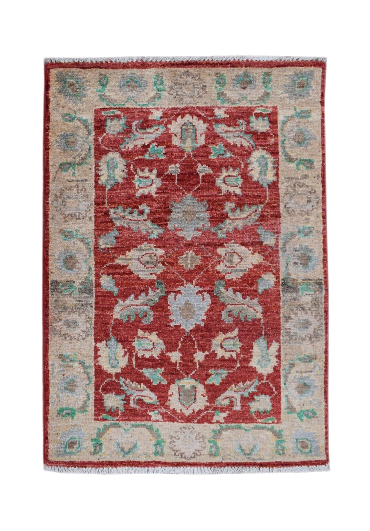 A handmade Afghan Chobi rug featuring a red central field with floral patterns and a beige border.