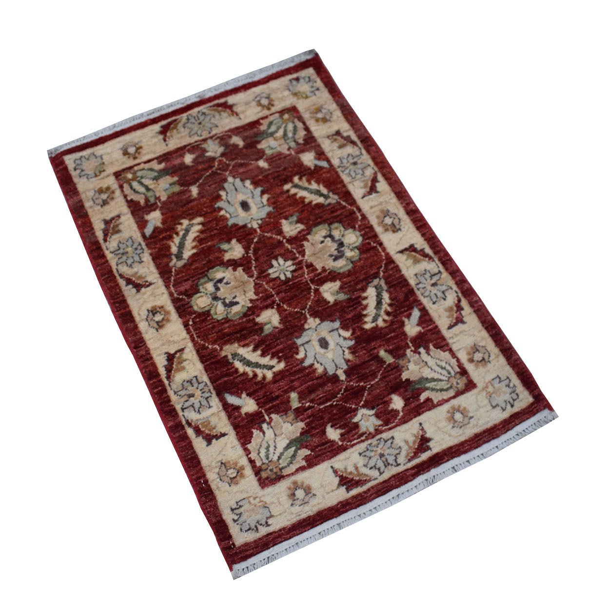 A rectangular handmade Afghan Chobi rug featuring a floral pattern in red and cream tones.