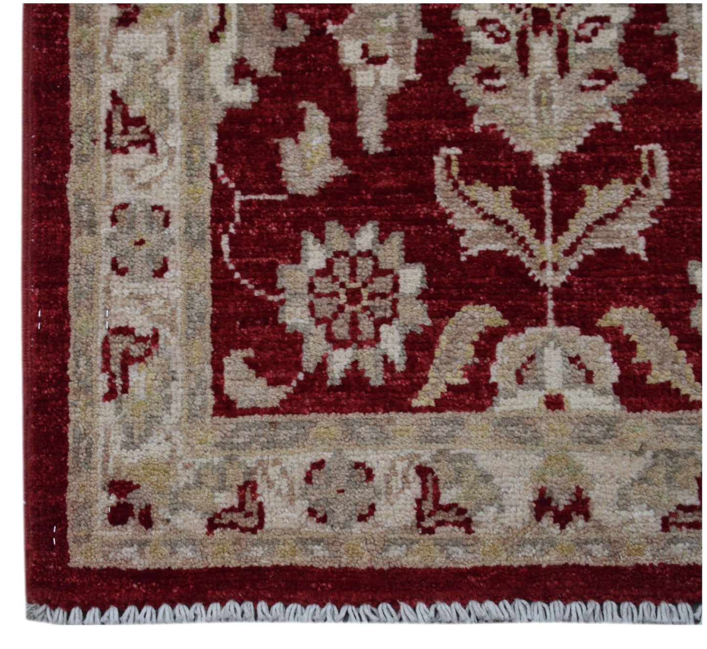 A handmade Afghan Chobi rug featuring a traditional floral pattern in red and beige tones.
