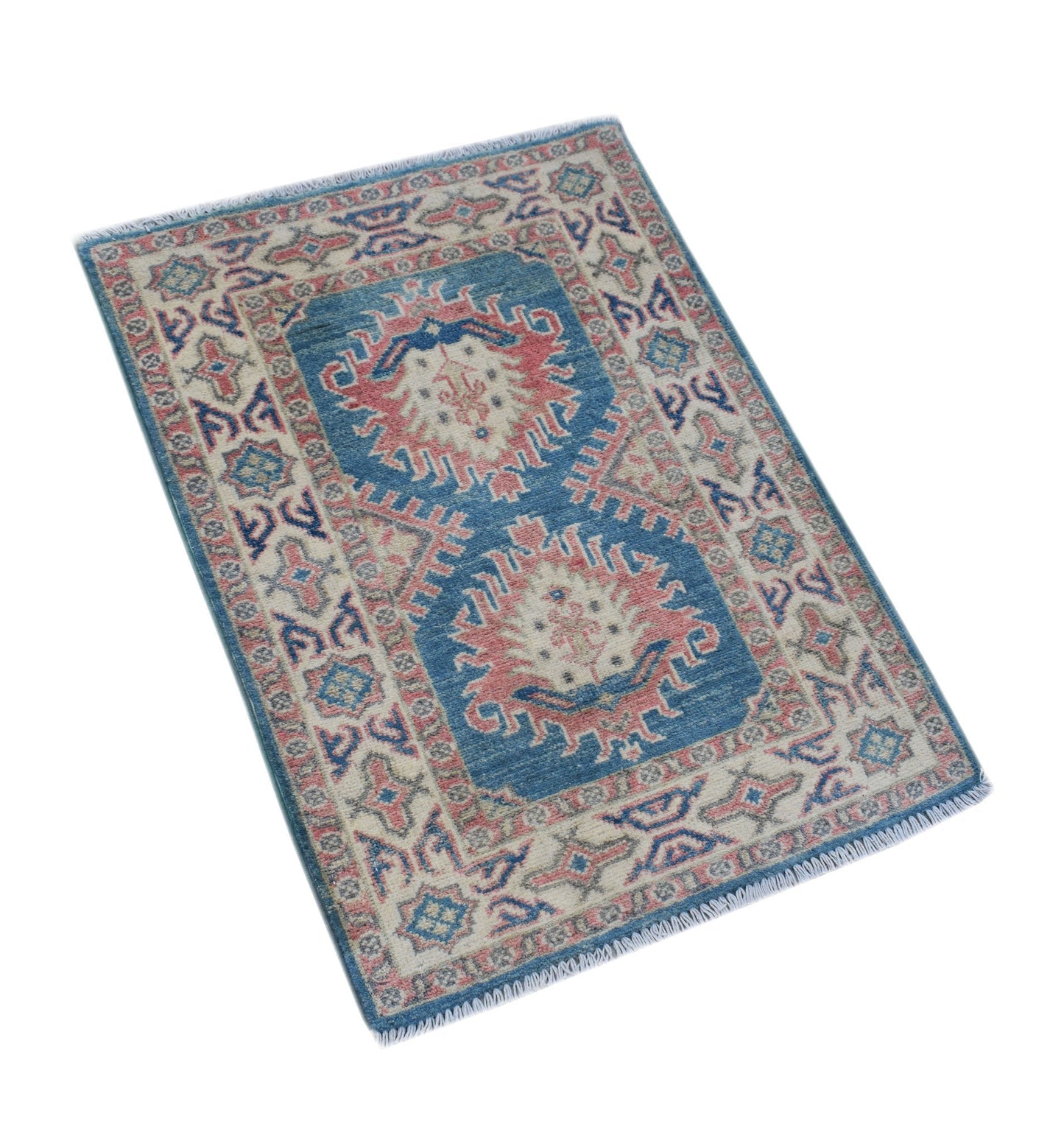 A handmade Afghan Kazakh rug featuring a blue field with two pink and cream geometric medallions.