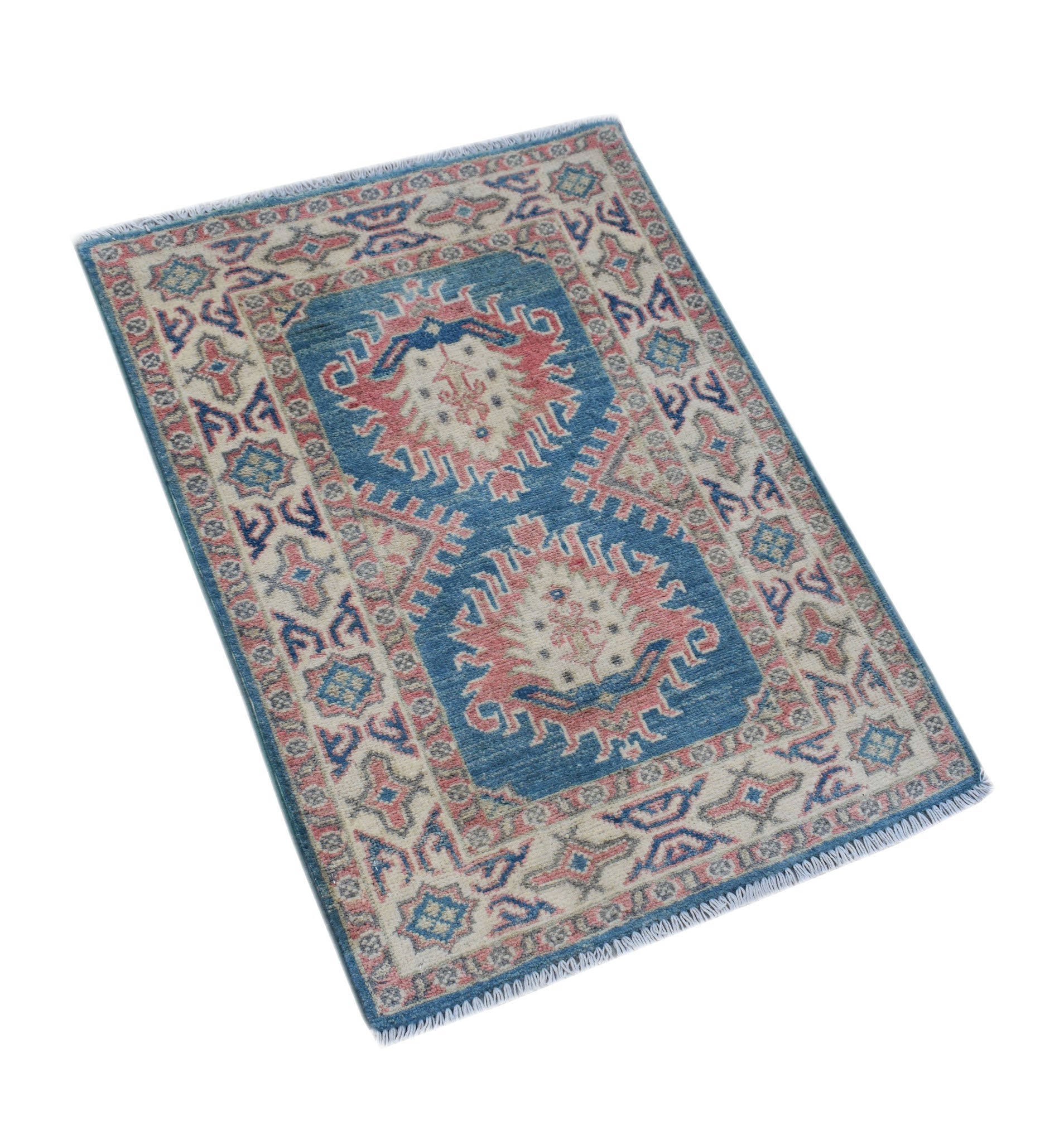 A handmade Afghan Kazakh rug featuring a blue field with two pink and cream geometric medallions.