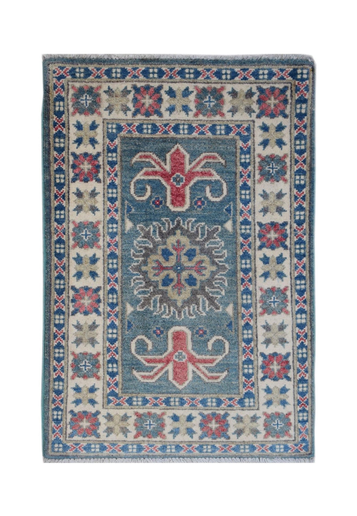 A handmade Afghan Kazakh rug featuring a central floral medallion on a blue field with patterned borders.