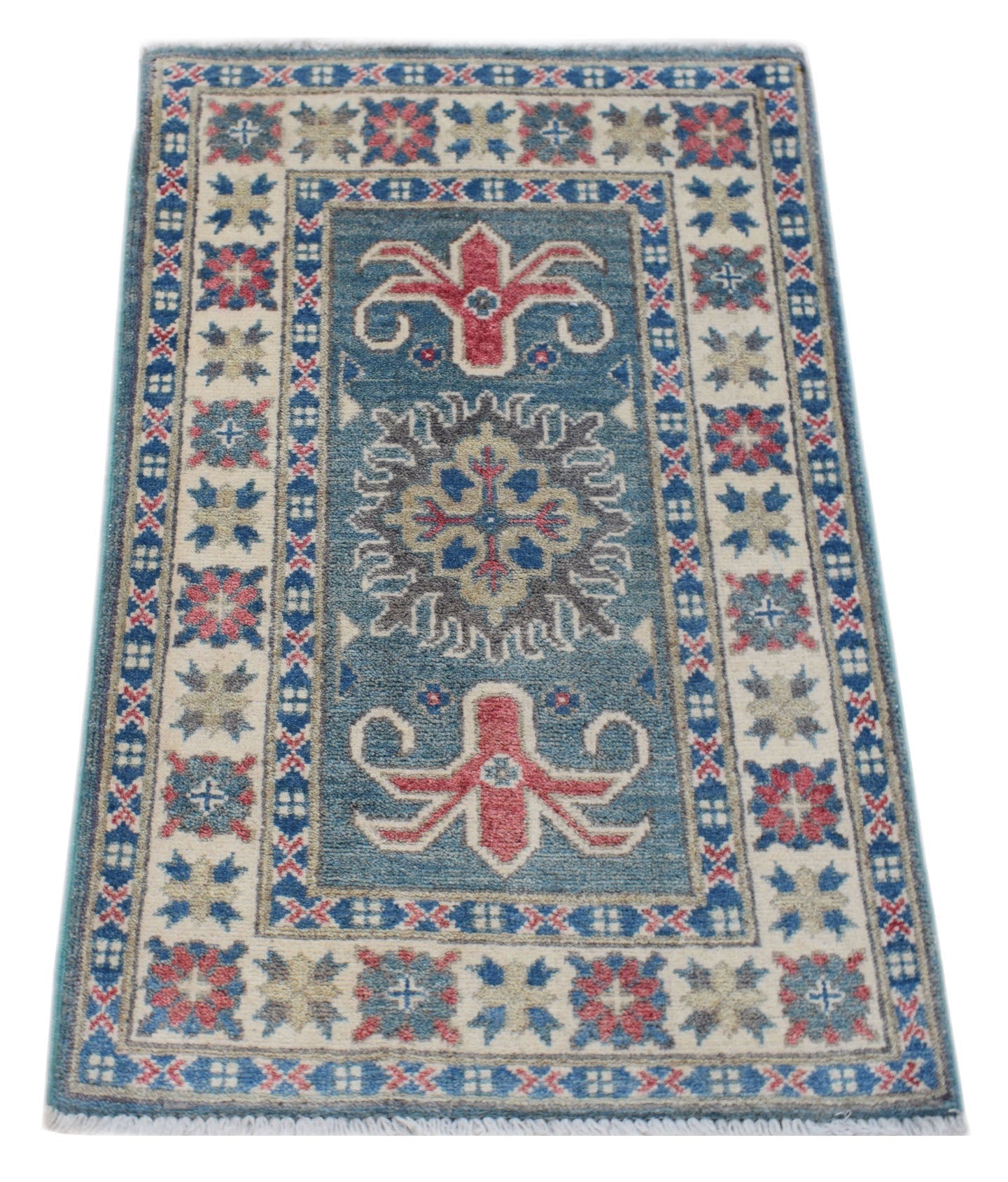A handmade wool Afghan Kazakh rug featuring a blue field with red and grey geometric motifs.