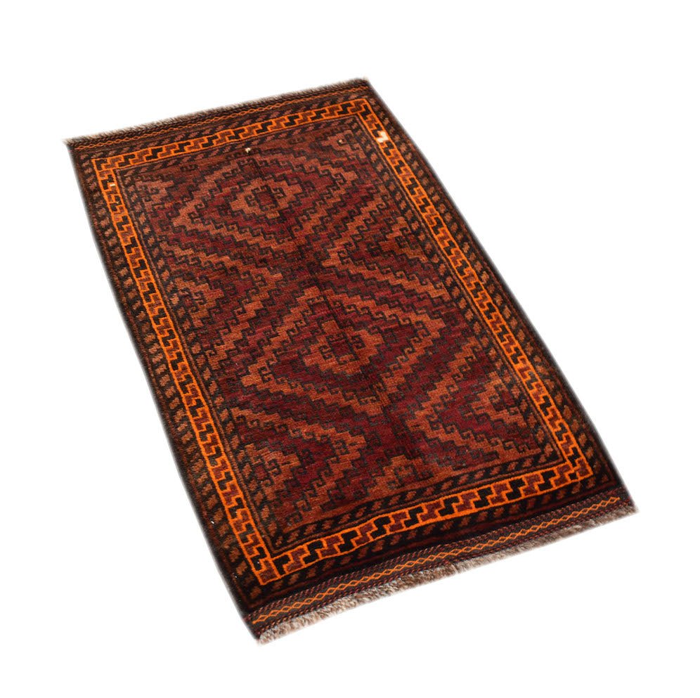 A vintage handmade Afghan Baluch rug featuring geometric diamond patterns in red and orange tones.