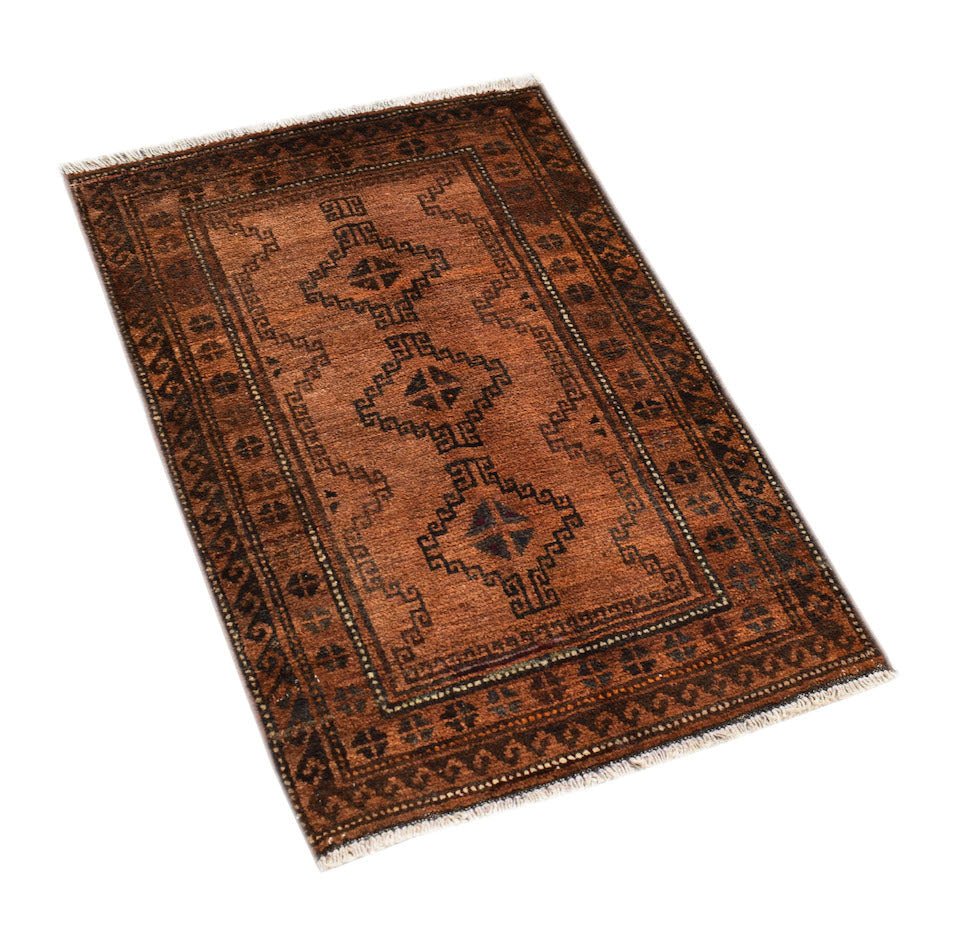 A handmade vintage Afghan Baluch rug featuring geometric diamond motifs in shades of brown.