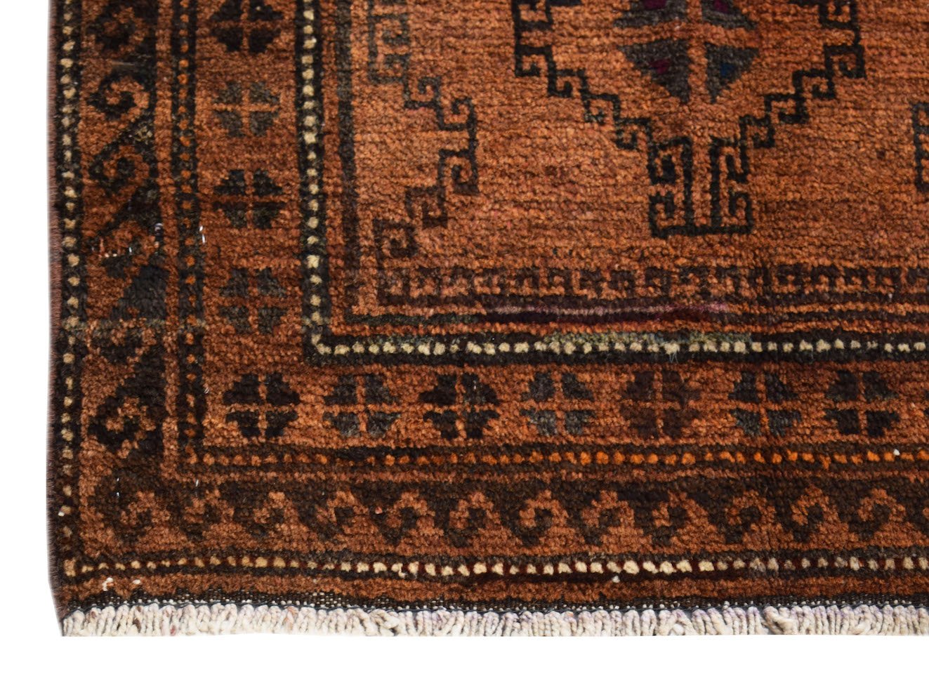 A vintage handmade Afghan Baluch rug featuring geometric patterns in shades of brown and dark red.