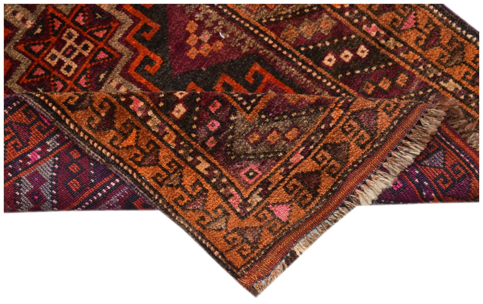 A vintage handmade Afghan Baluch wool rug featuring geometric patterns in deep red and orange tones.