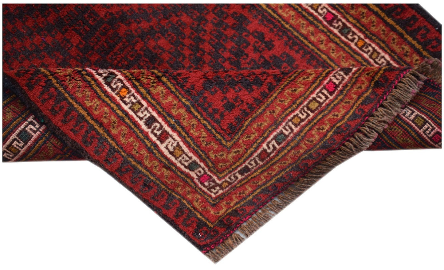 A vintage handmade Afghan Baluch rug featuring a dark red and brown geometric pattern with fringe.