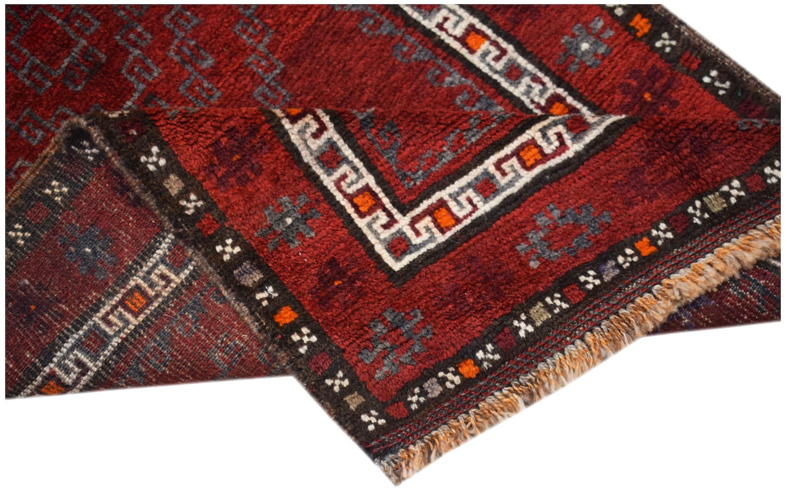 A vintage handmade Afghan Baluch wool rug featuring a deep red field with geometric tribal patterns.