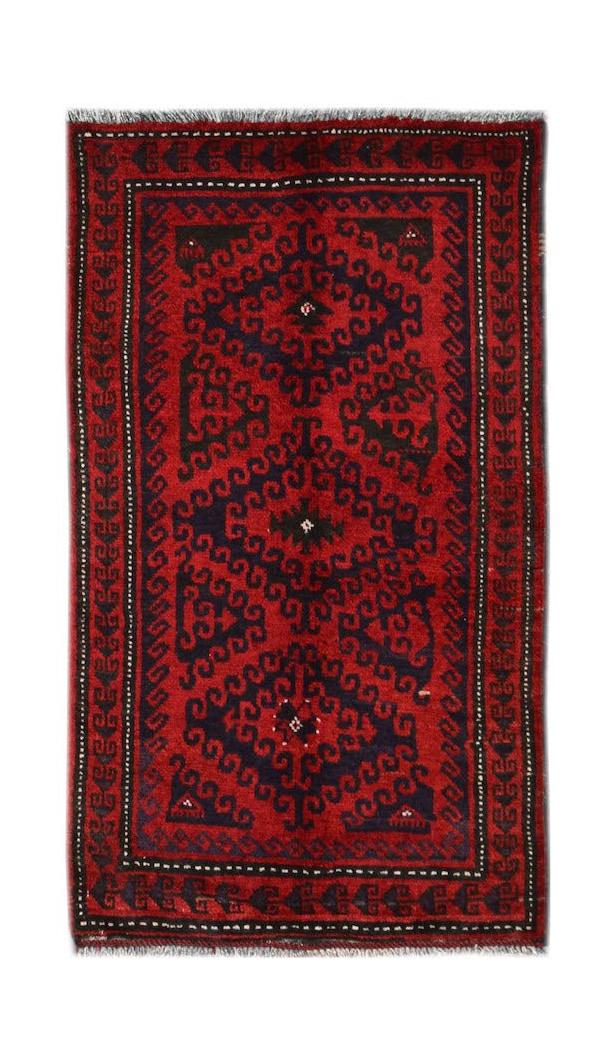 A vintage handmade Afghan Baluch rug featuring a dark red field with repeating geometric motifs.