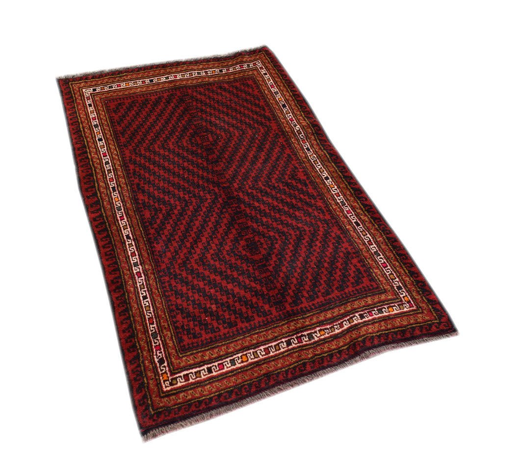 A handmade vintage Afghan Baluch rug featuring a geometric diamond pattern in dark red and black.
