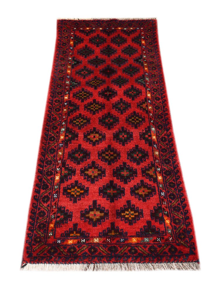 A vintage handmade Afghan Baluch runner rug featuring a repeating geometric pattern in red and black.