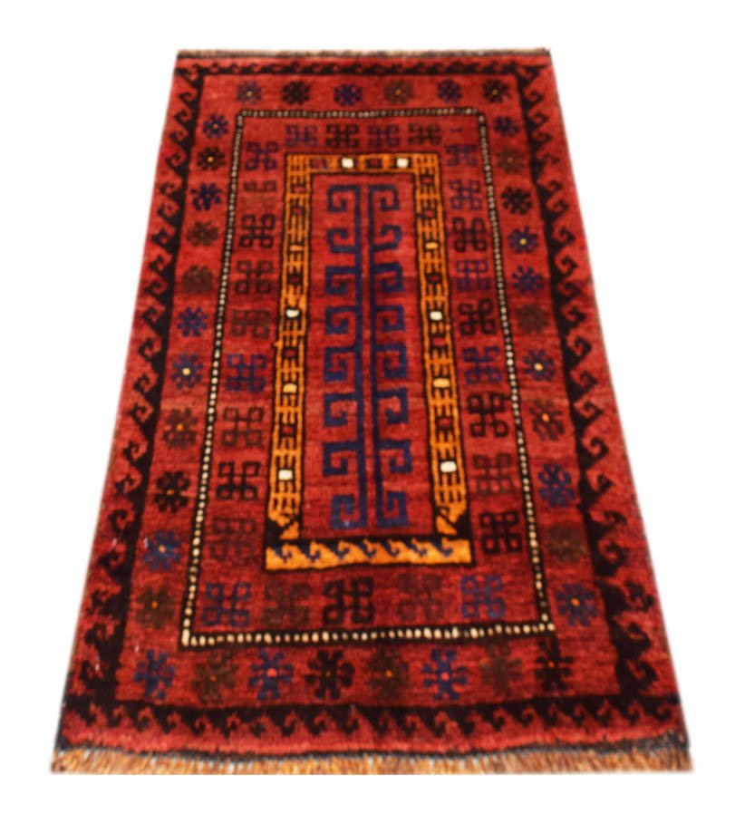 A vintage handmade Afghan Baluch wool rug featuring a red field with geometric tribal patterns.