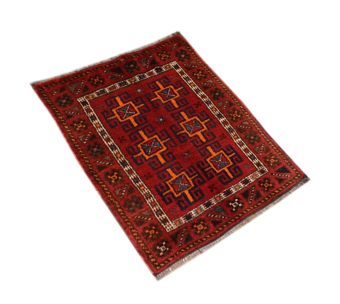 Vintage Afghan Baluch rug with geometric patterns in red and orange.