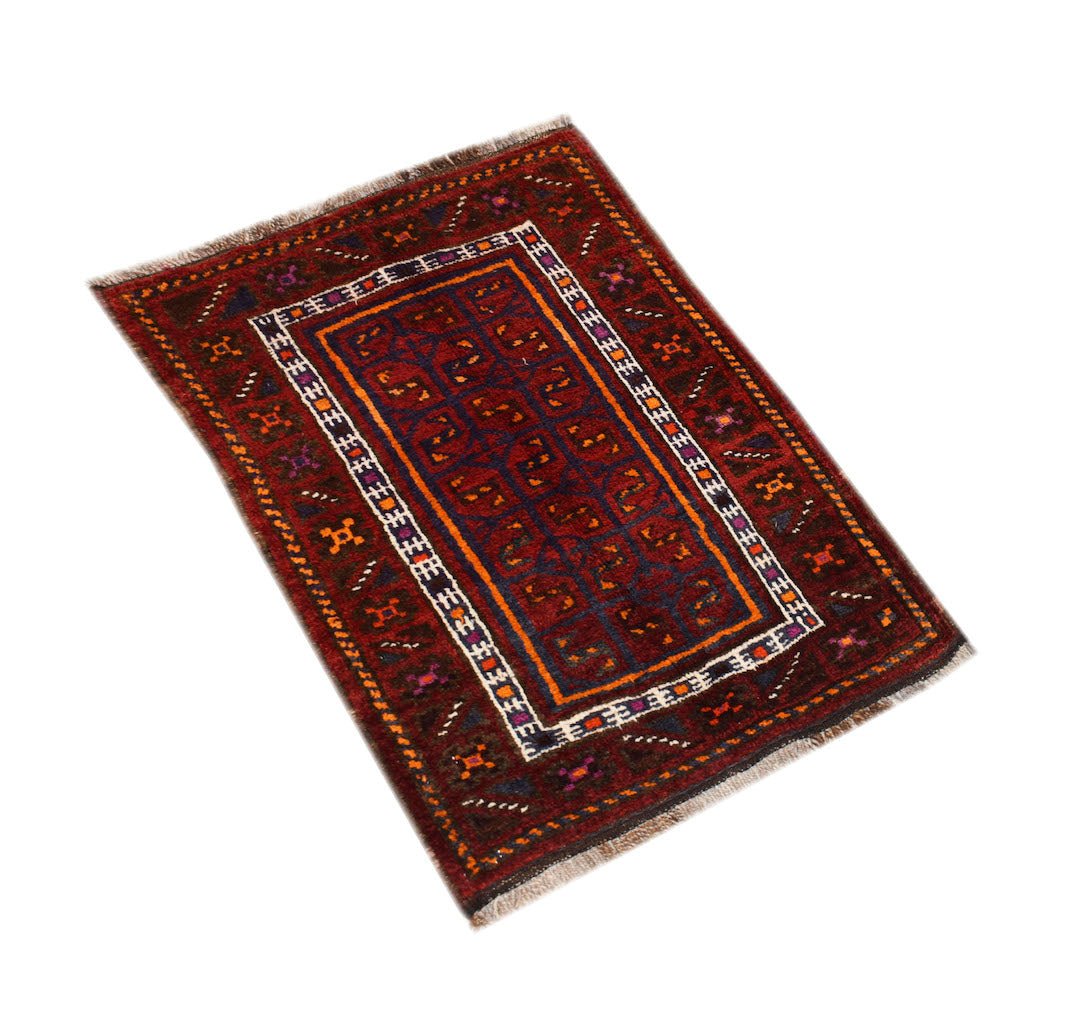 A vintage handmade Afghan Baluch wool rug featuring a dark red geometric pattern and fringe ends.