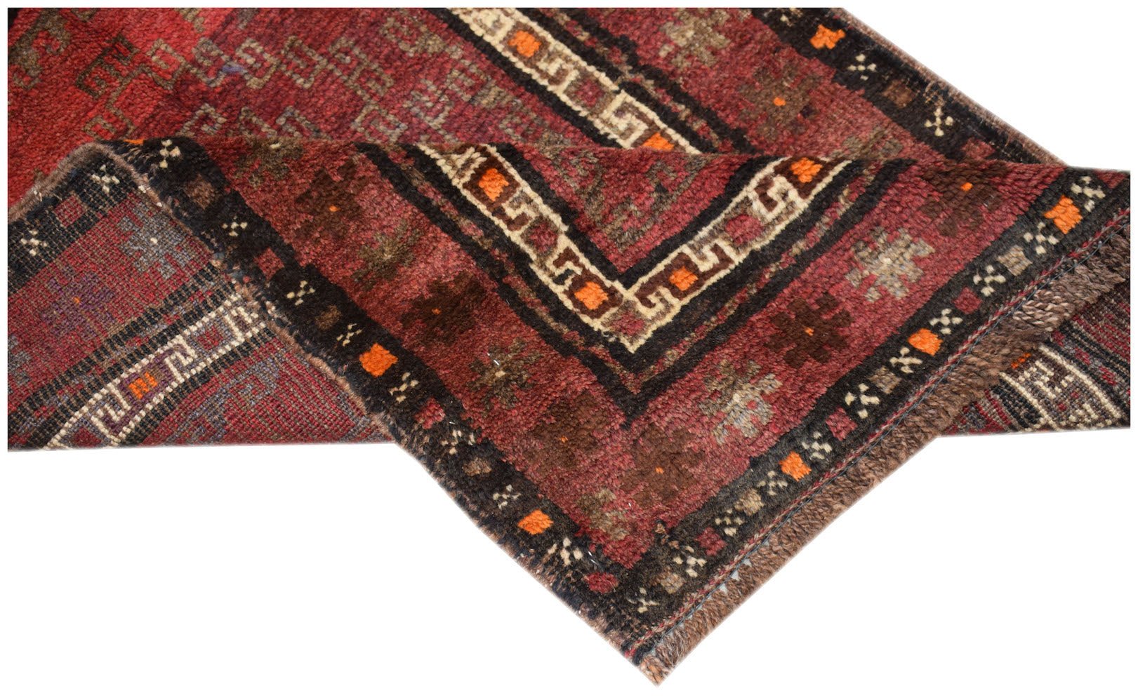 A vintage handmade Afghan Baluch rug featuring geometric patterns in deep red, brown, and ivory.