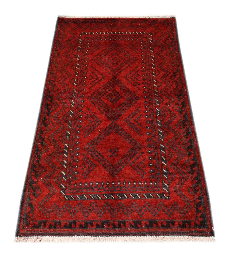 A vintage handmade Afghan Baluch wool rug featuring a geometric diamond pattern in red and black.