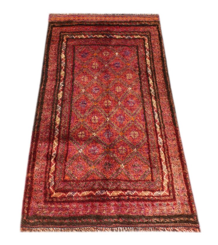 A vintage handmade Afghan Baluch rug featuring a red diamond pattern and fringed edges.