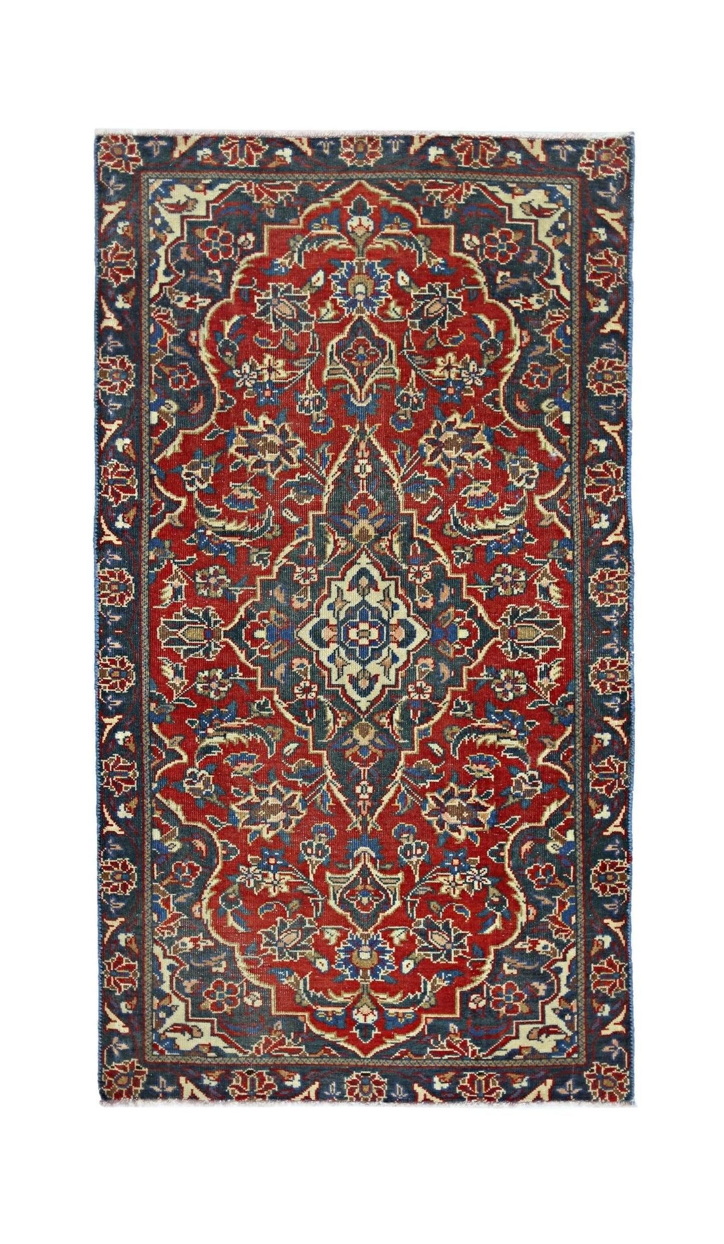 A vintage Persian rug featuring a central medallion and floral patterns in red and blue tones.