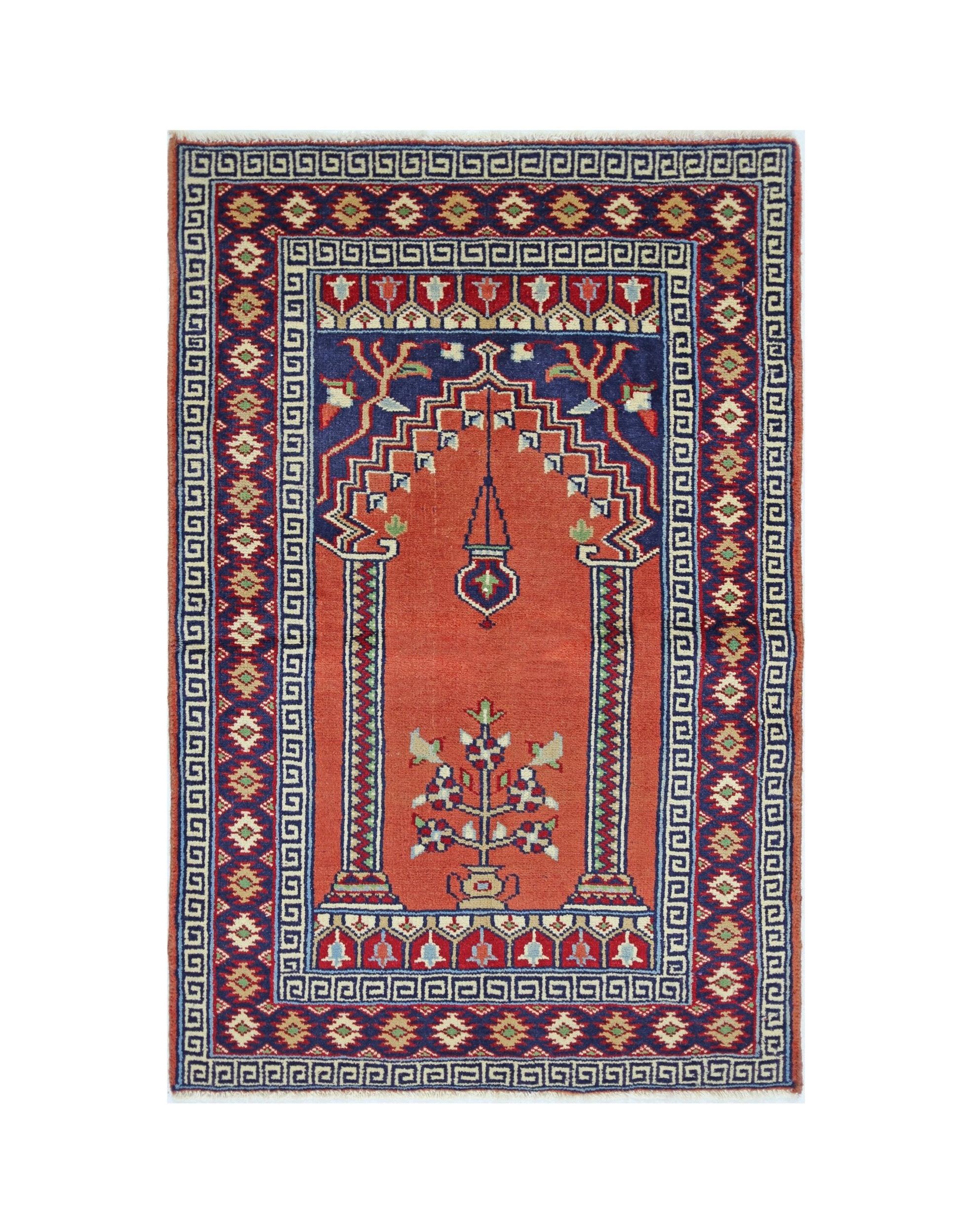 A vintage Turkish Kayseri rug featuring a central prayer niche design with floral motifs in red and blue.