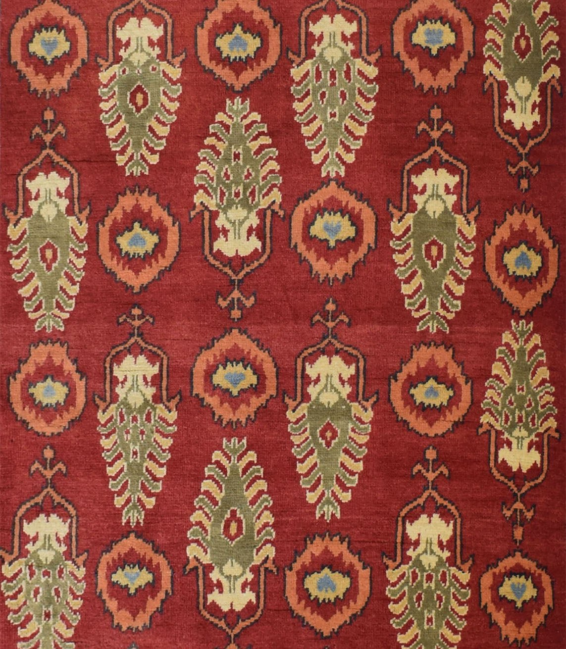 An Afghan Chobi runner featuring a repeating pattern of stylized floral motifs on a red background.
