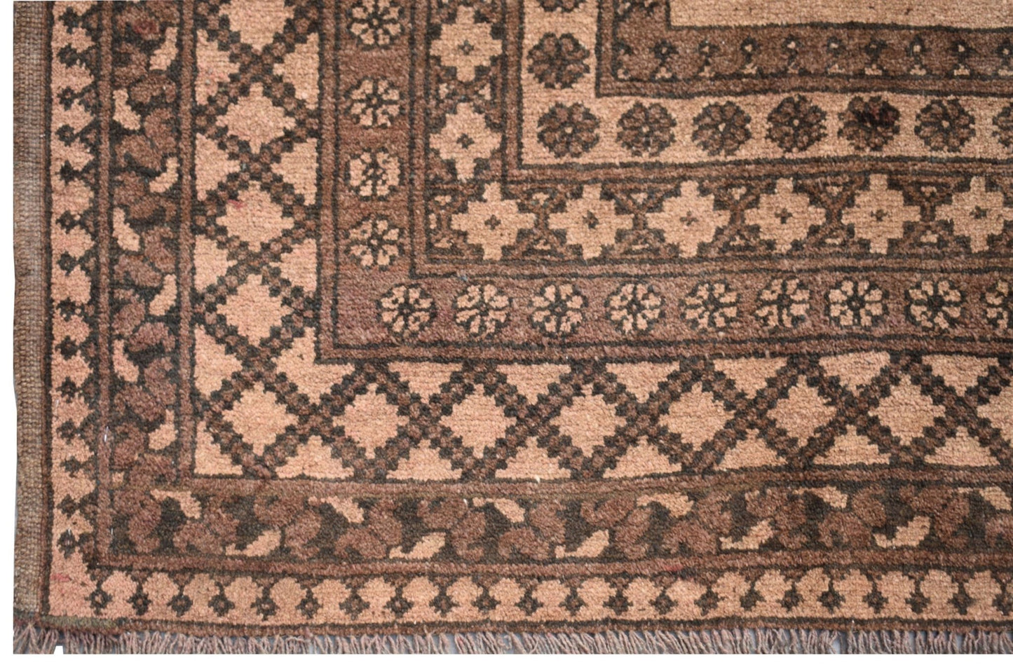 A vintage Afghan Turkmen rug featuring a geometric diamond pattern in shades of brown and tan.