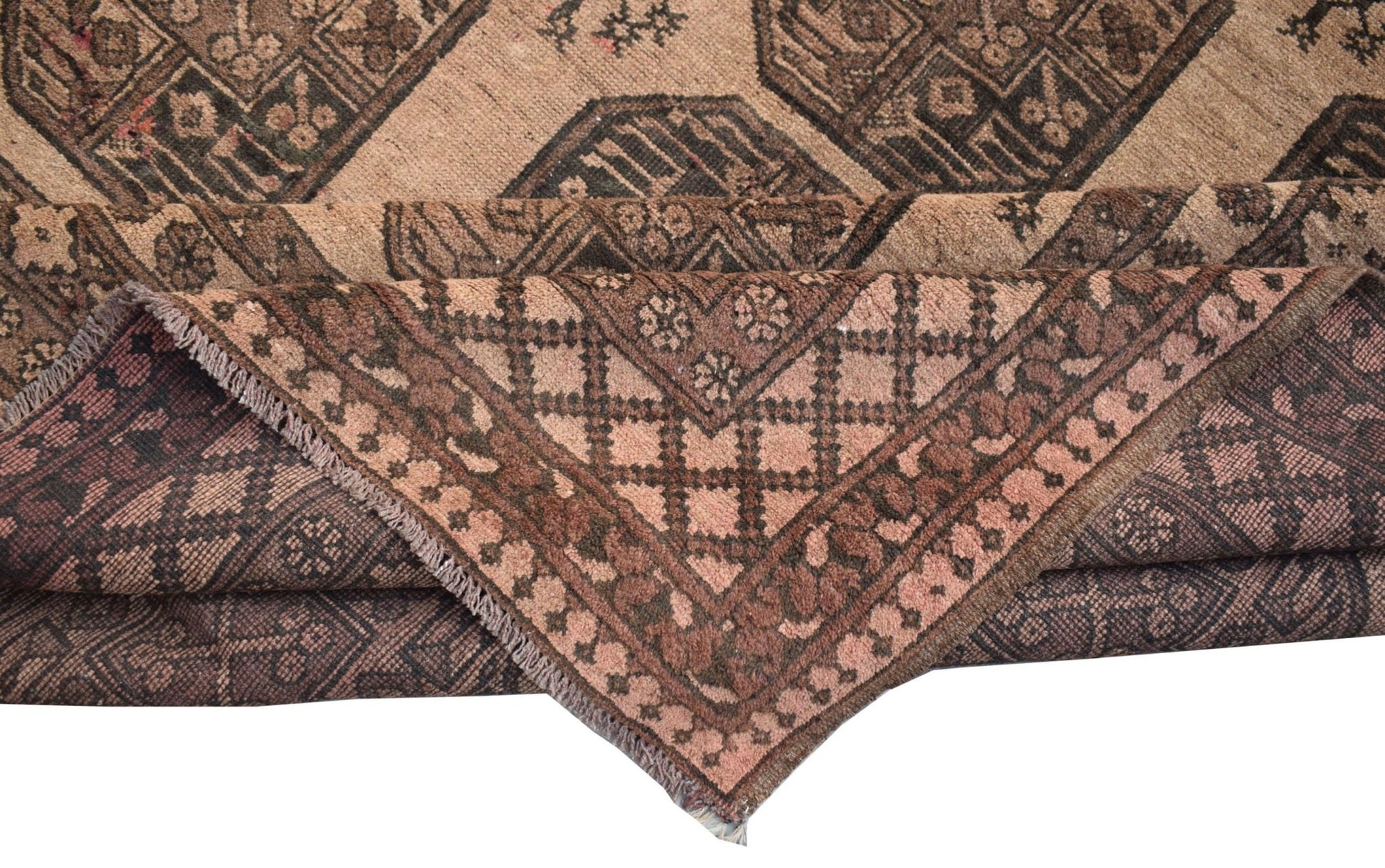 A vintage handmade Afghan Turkmen wool rug featuring geometric patterns in shades of brown.