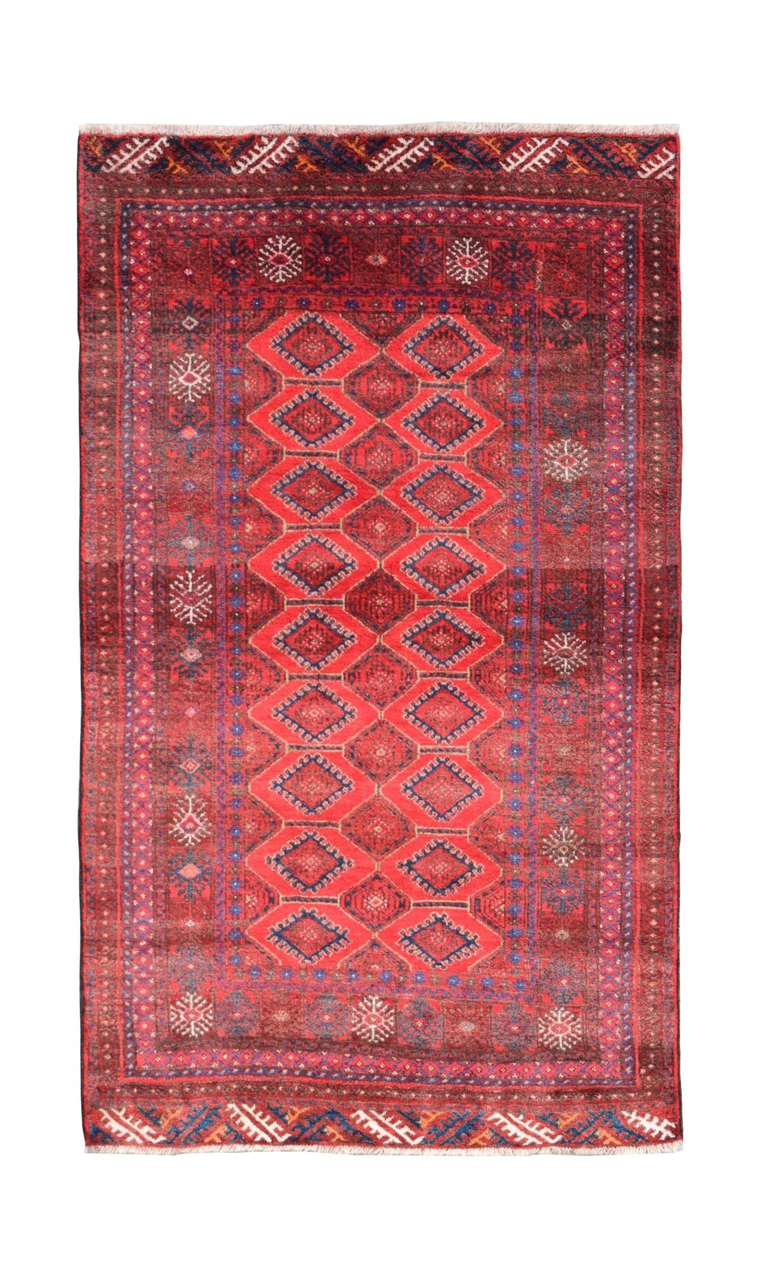 A vintage handmade Afghan Baluch wool rug featuring a red field with repeating diamond patterns.