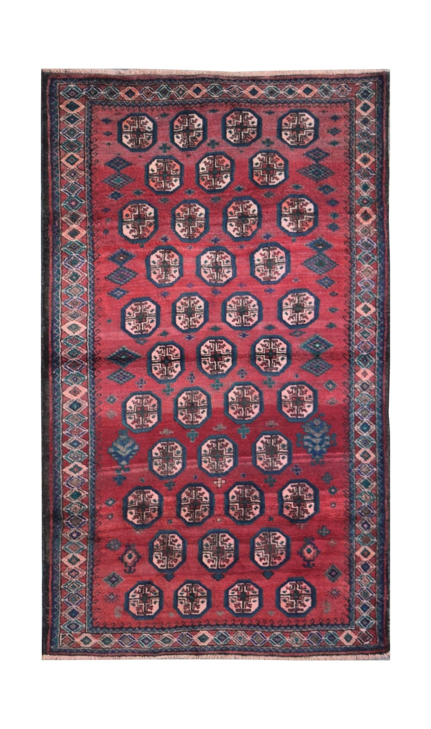 A vintage Afghan Baluch rug featuring a repeating octagonal pattern in red, blue, and cream wool.