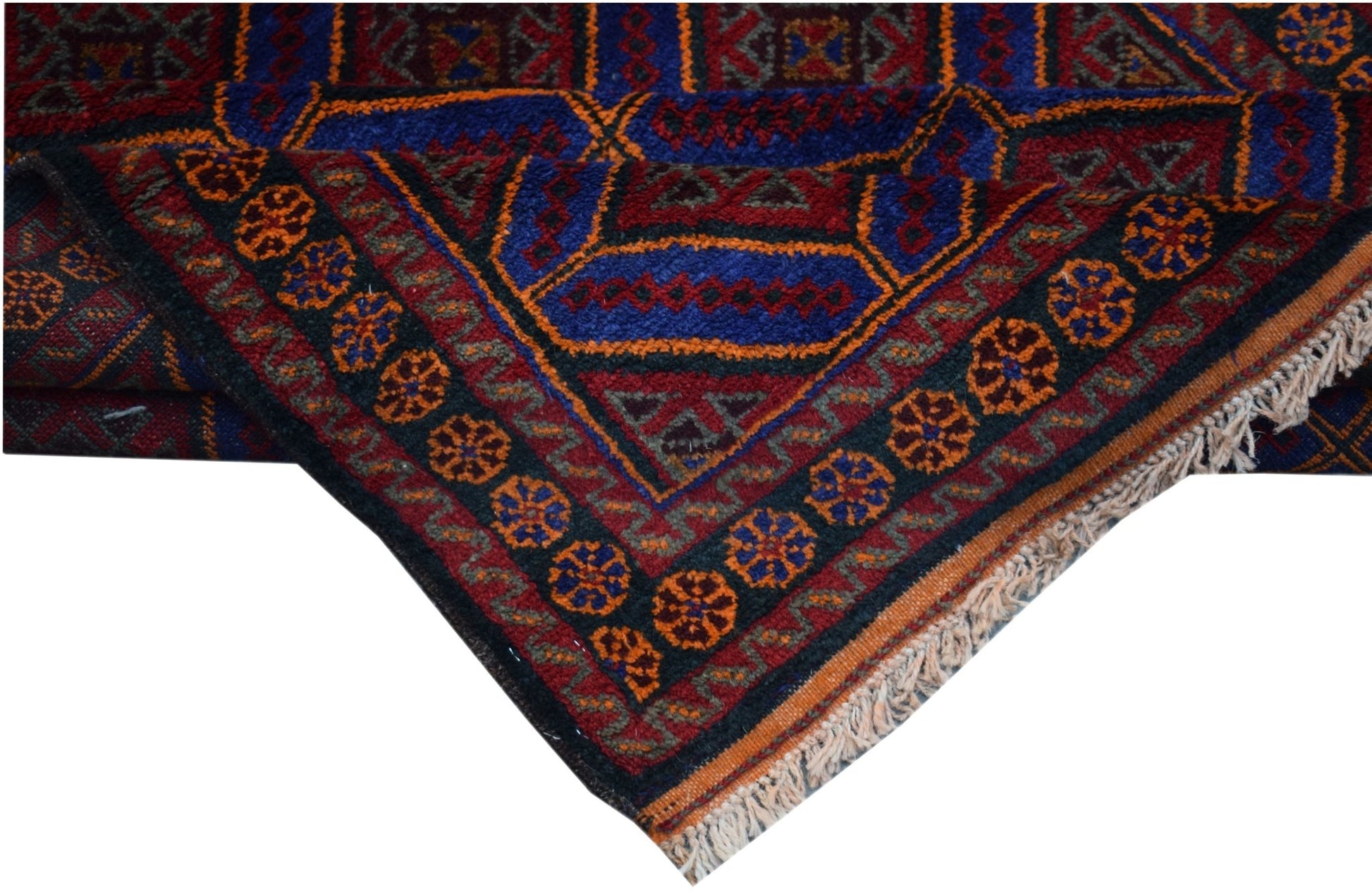 A vintage handmade Afghan Baluch wool rug featuring geometric patterns in red, blue, and orange.