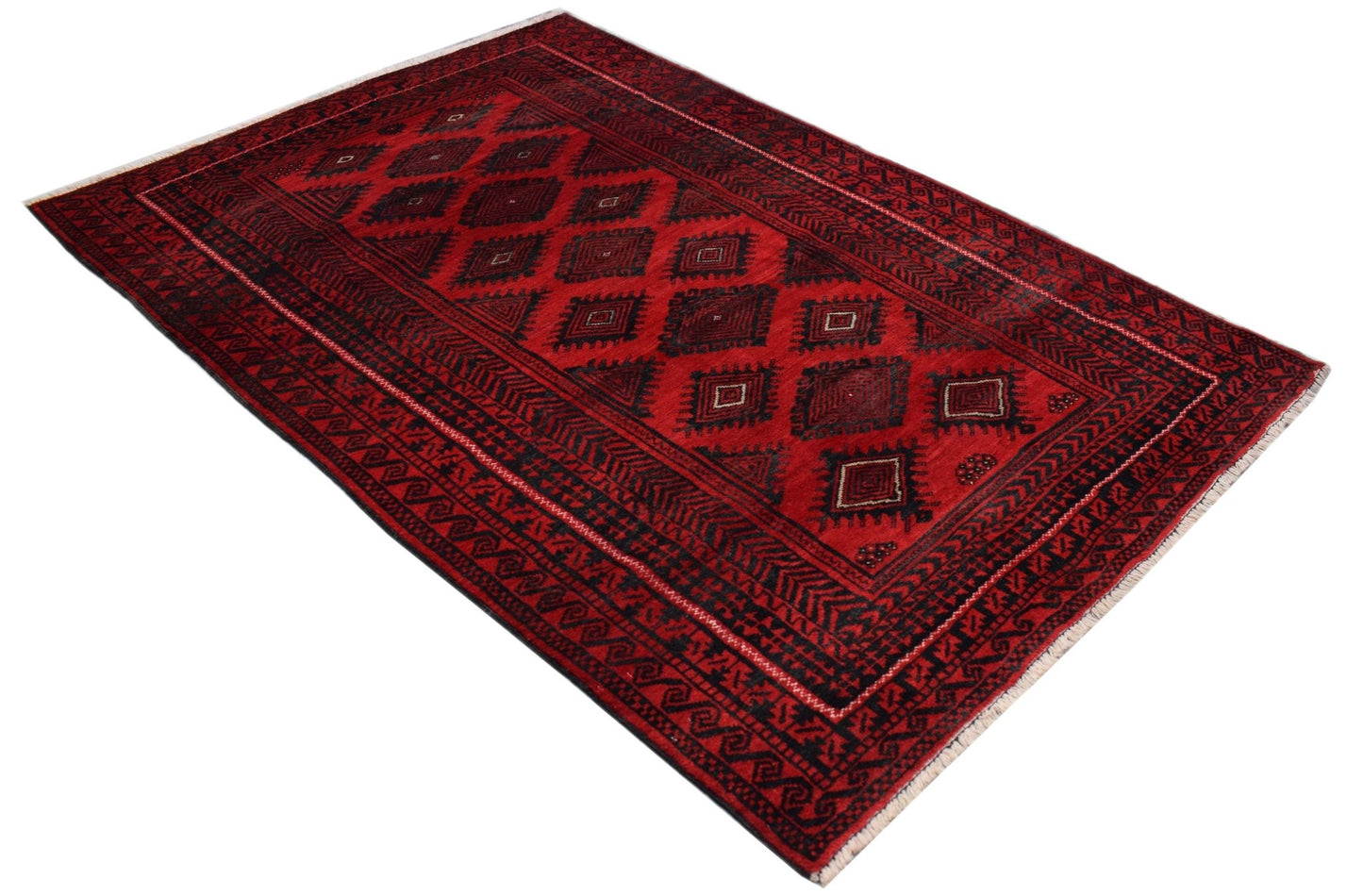 A vintage Afghan Baluch rug featuring a deep red field with repeating black geometric motifs.