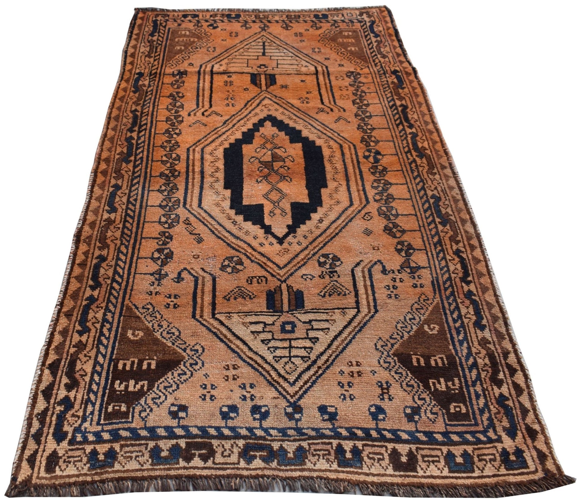 A vintage Afghan Baluch wool rug featuring a geometric diamond pattern in orange and dark blue.