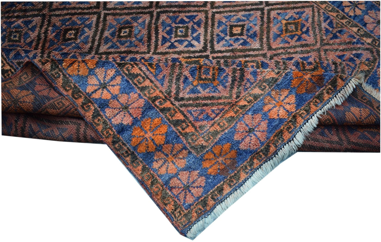 A vintage Afghan Baluch rug featuring a geometric grid pattern in blue, orange, and brown tones.