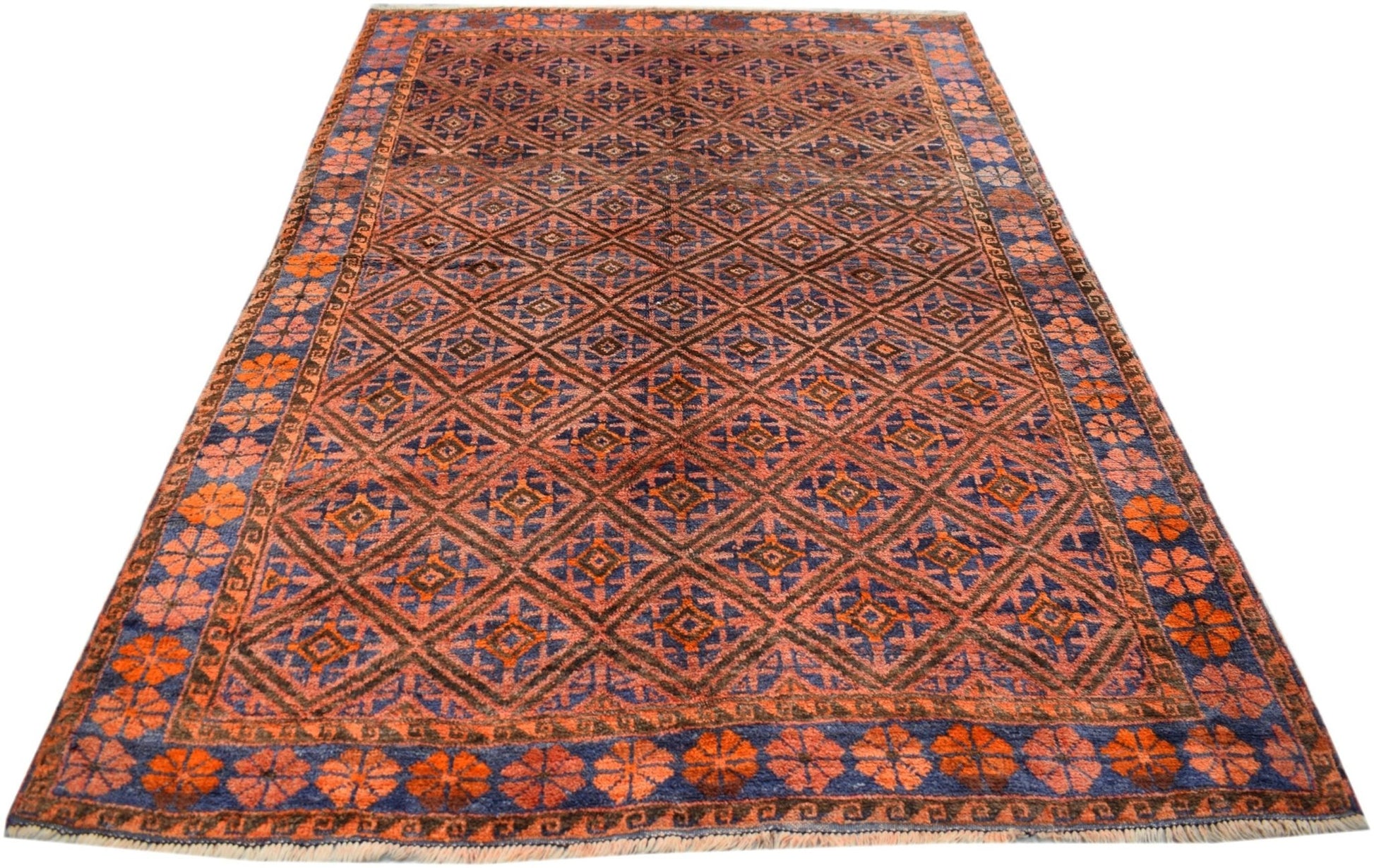 A vintage handmade Afghan Baluch rug featuring a repeating diamond pattern in orange and blue.