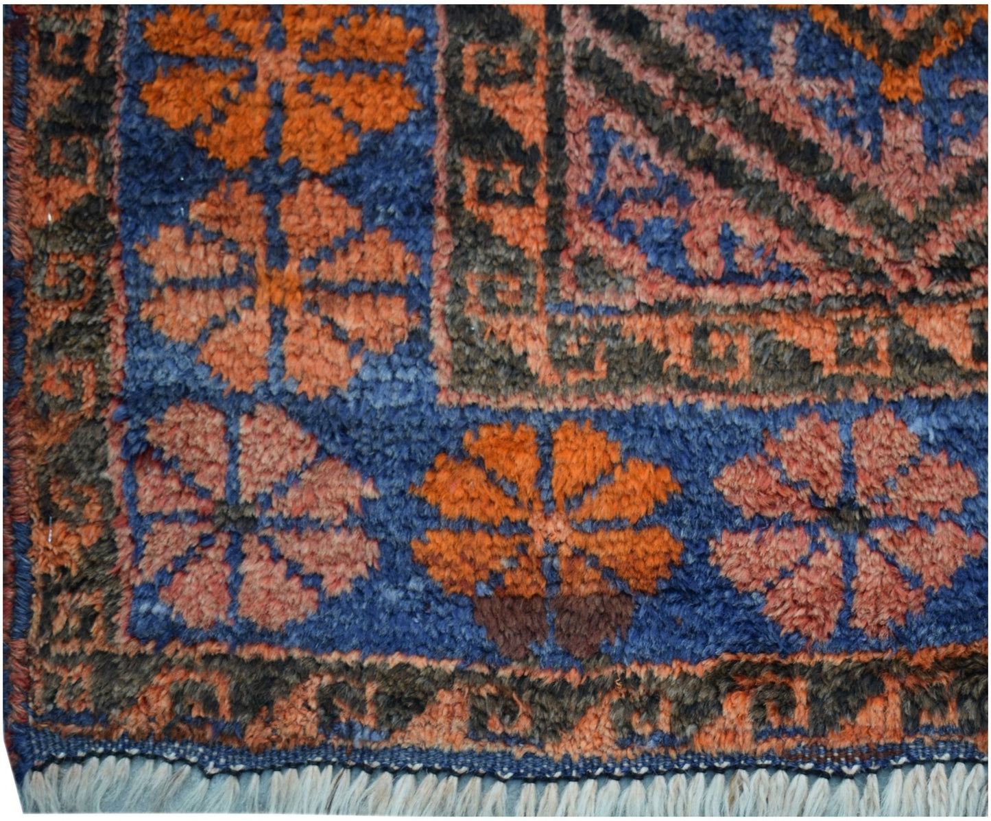 A vintage Afghan Baluch rug featuring a blue field with orange and pink floral motifs.