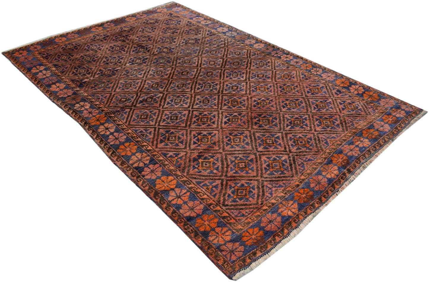 A vintage Afghan Baluch rug featuring a repeating diamond pattern in shades of rust and blue.
