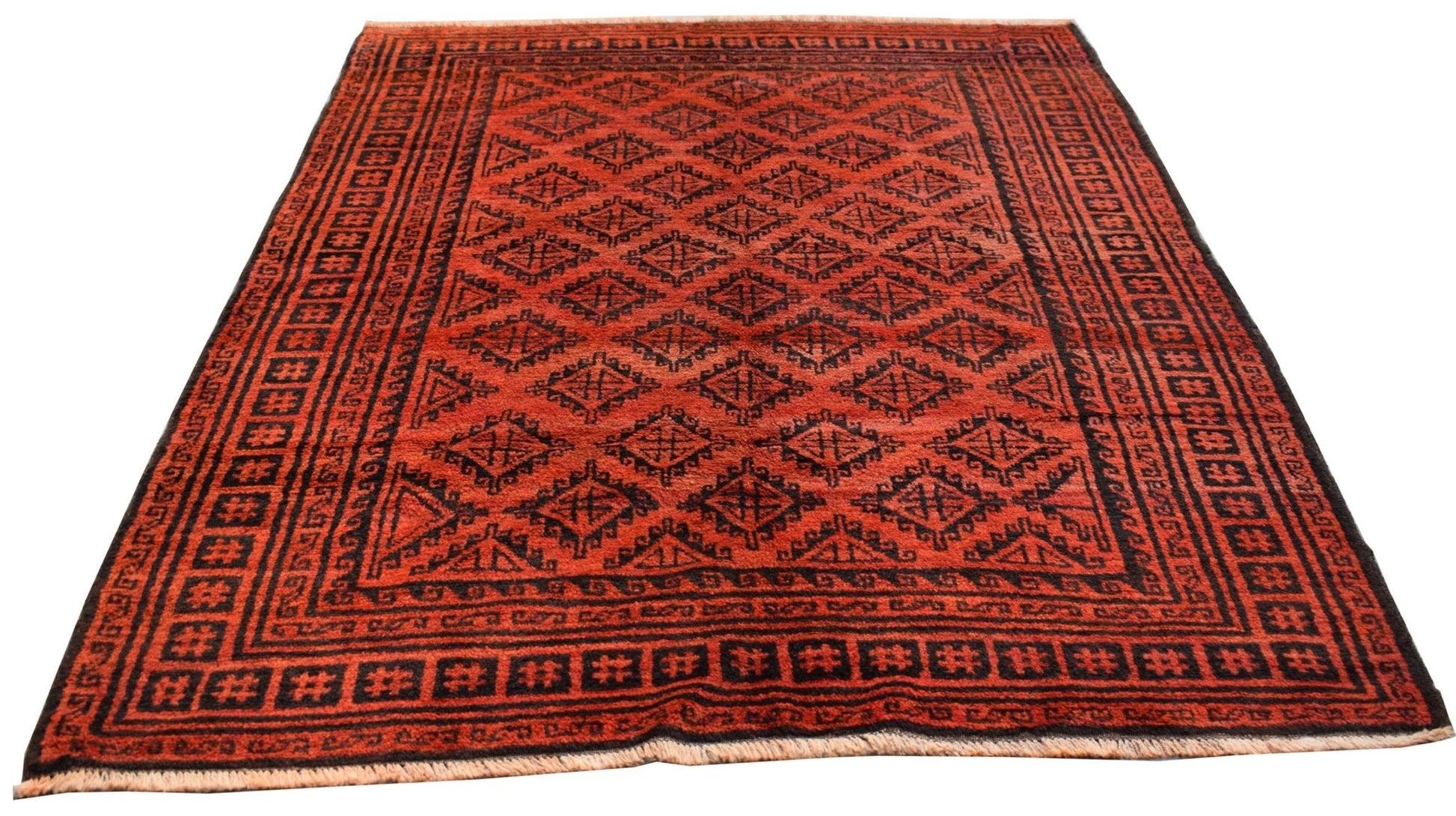 A vintage Afghan Baluch rug featuring a repeating black diamond pattern on a deep red background.