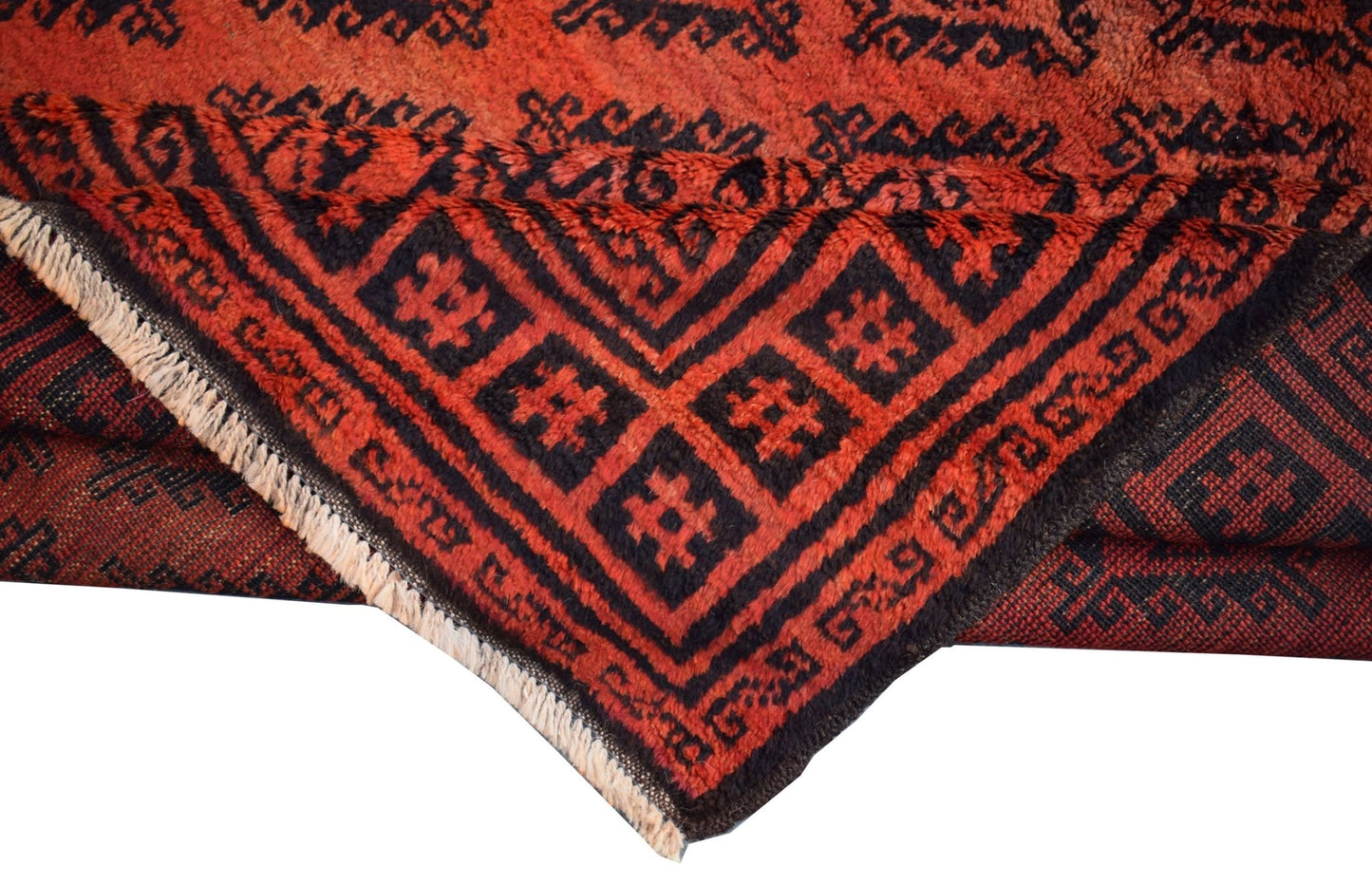 A vintage Afghan Baluch wool rug featuring a geometric black pattern on a deep red background.