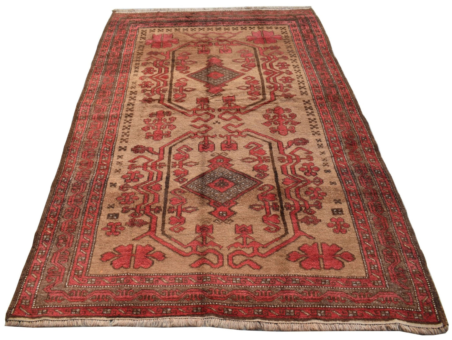 A vintage handmade Afghan Baluch wool rug featuring geometric patterns in red and brown tones.