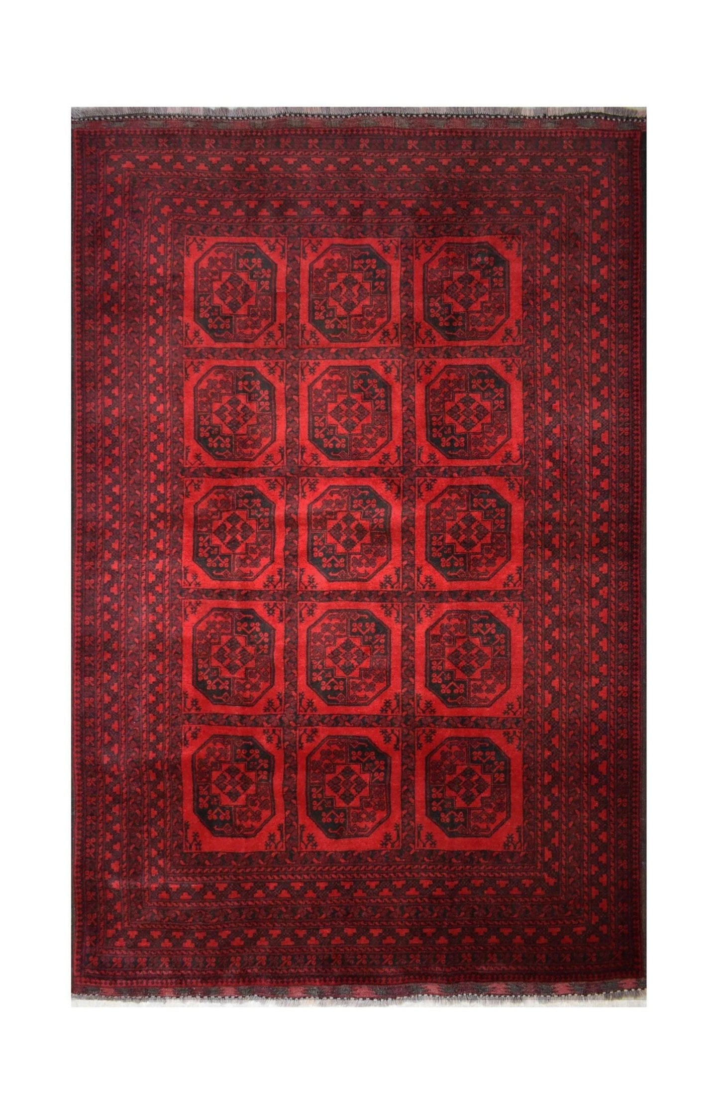 A vintage handmade Afghan Turkmen rug featuring a repeating geometric octagonal pattern in red.